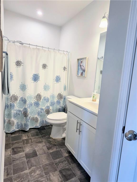 3042 Lowell Road Bethlehem, GA 30620 - Photo 26 of 53 a bathroom with a toilet and a shower