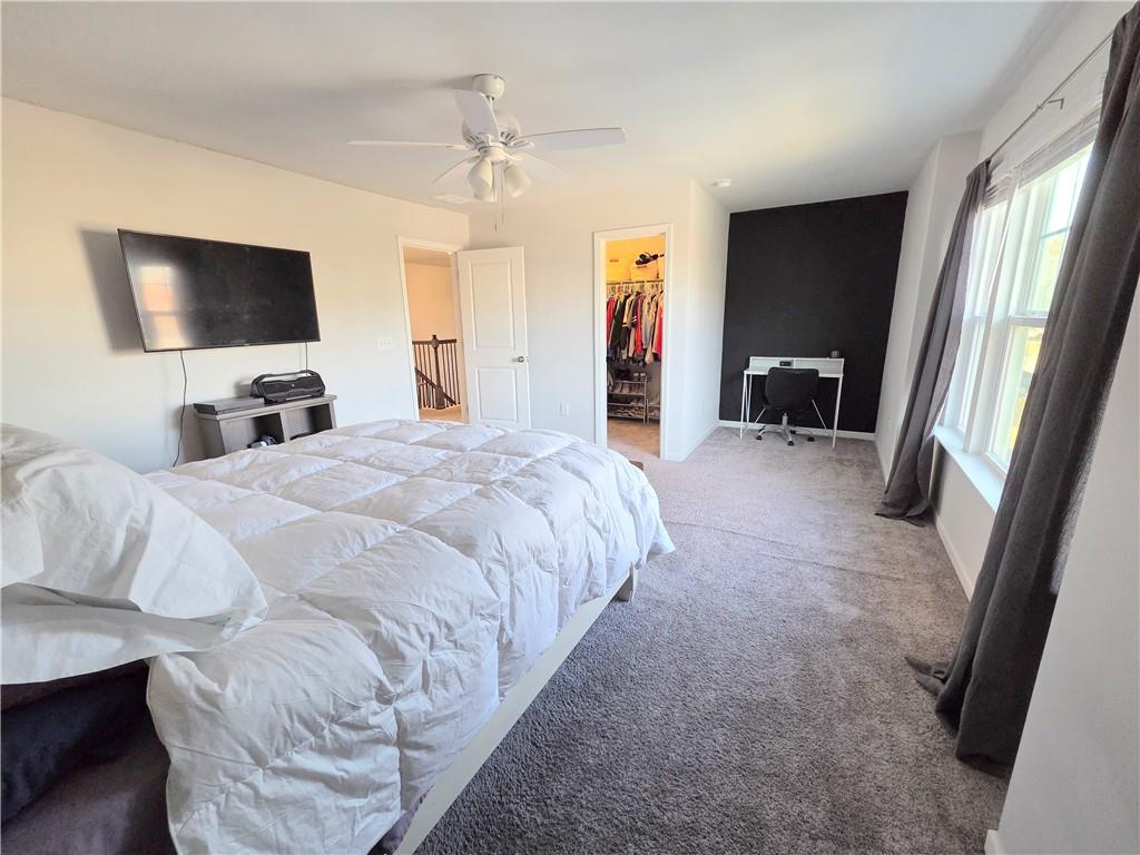 3042 Lowell Road Bethlehem, GA 30620 - Photo 38 of 53 a bedroom with a bed and a flat screen tv