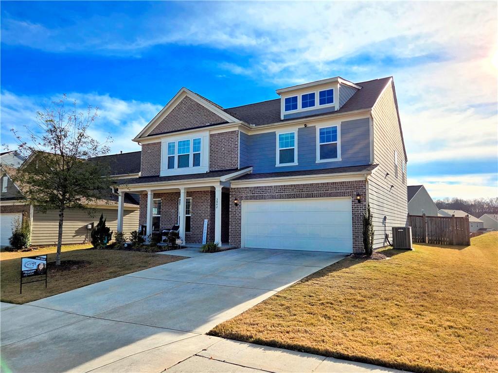 3042 Lowell Road Bethlehem, GA 30620 - Photo 4 of 53 a front view of a house with a yard
