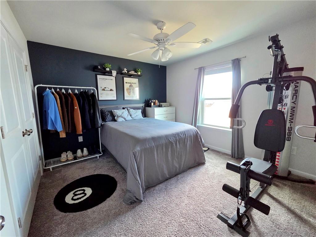 3042 Lowell Road Bethlehem, GA 30620 - Photo 43 of 53 a bedroom with bed and a chandelier