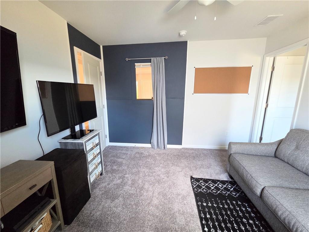 3042 Lowell Road Bethlehem, GA 30620 - Photo 45 of 53 a living room with furniture and a flat screen tv