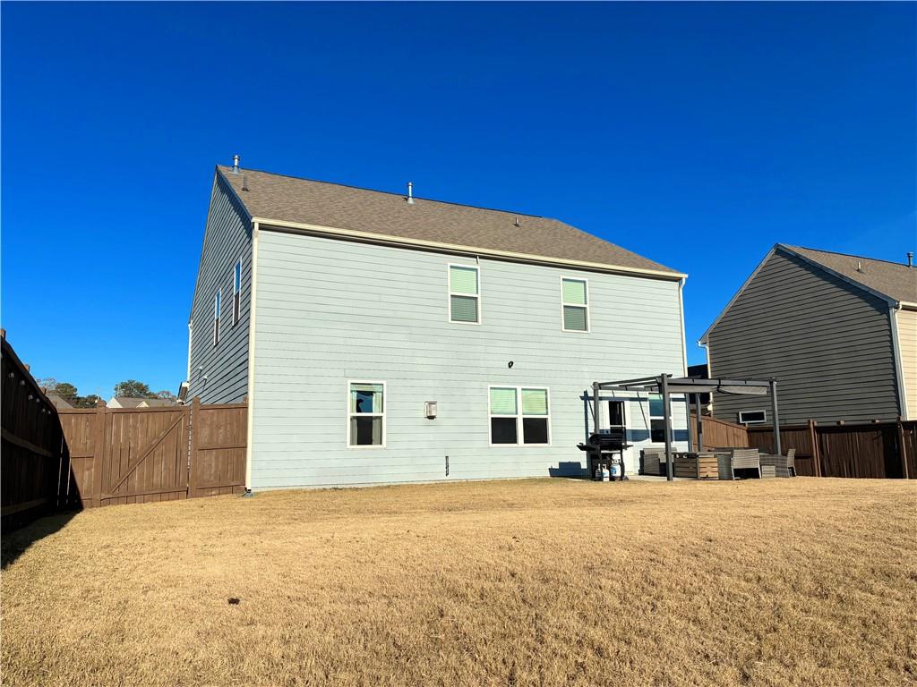 3042 Lowell Road Bethlehem, GA 30620 - Photo 50 of 53 a view of a house with a backyard