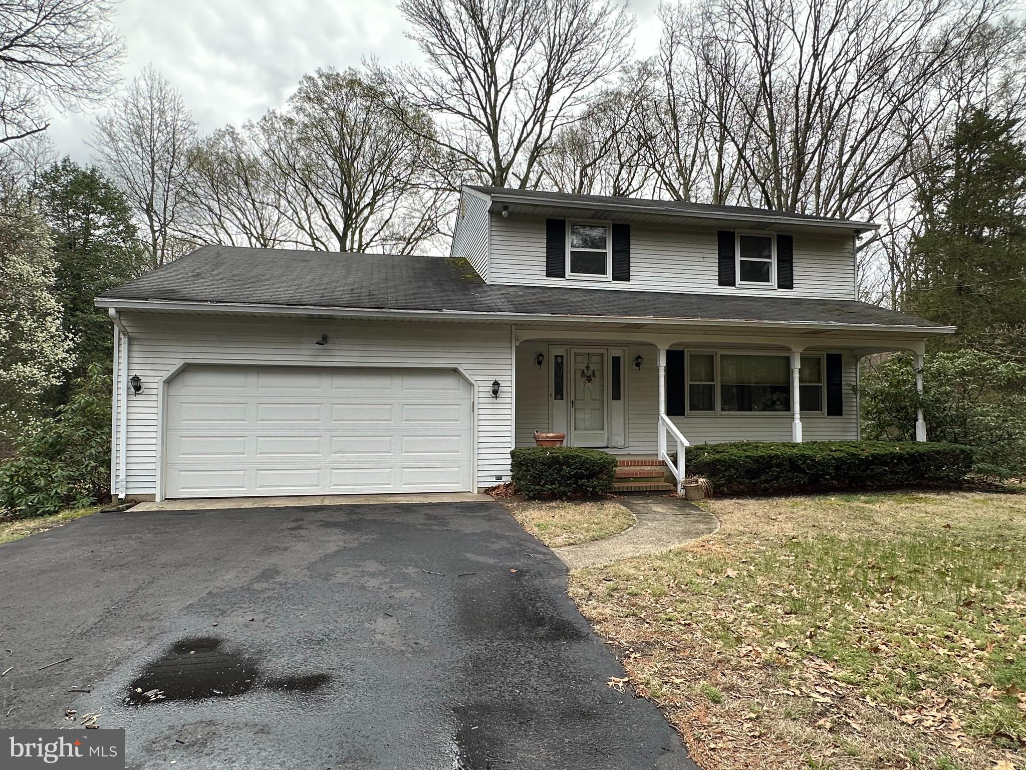 575 Centerton Road Elmer, NJ 08318 - Photo 1 of 28 a front view of a house with a yard and garage