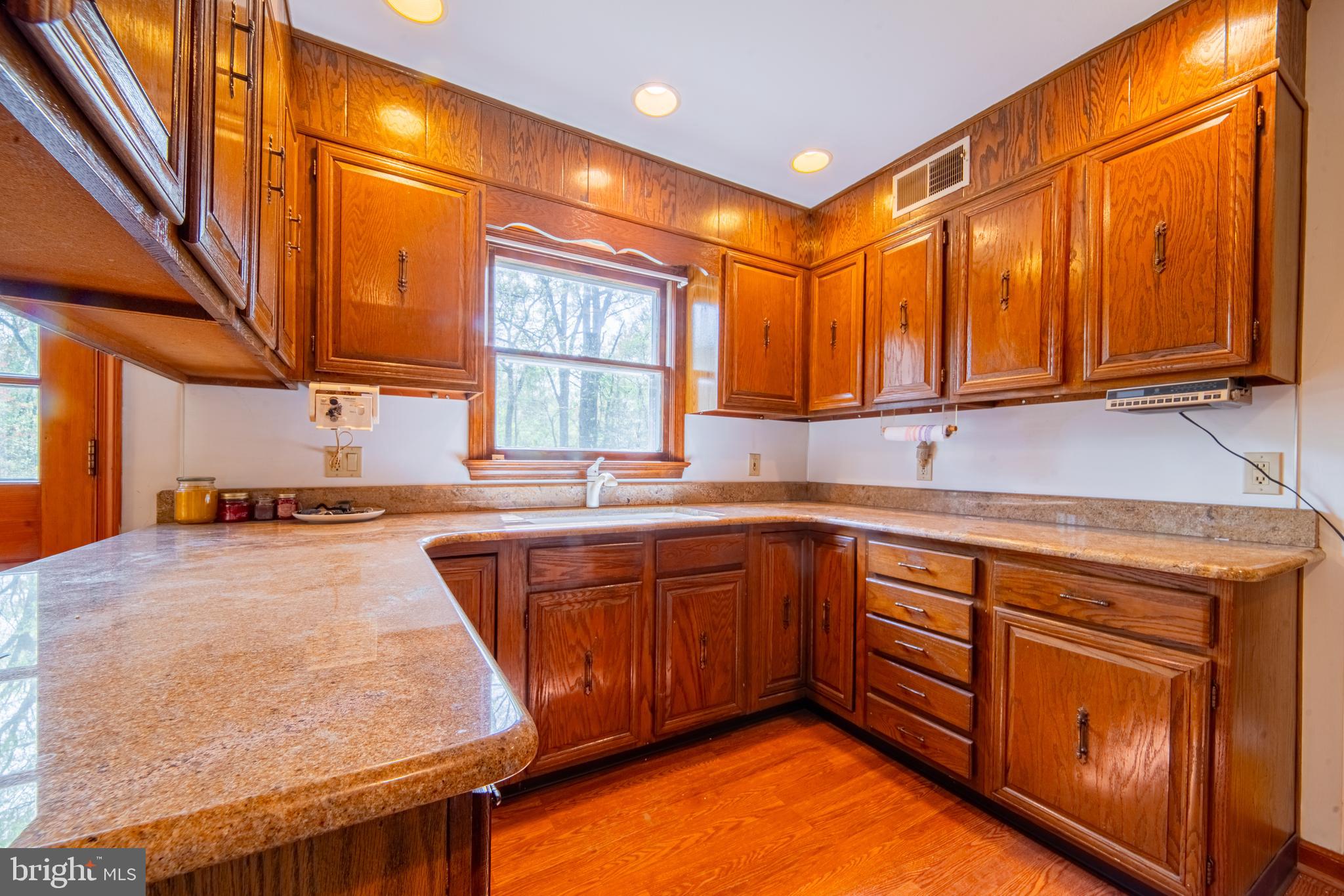 575 Centerton Road Elmer, NJ 08318 - Photo 13 of 28 a kitchen with a sink a window and cabinets