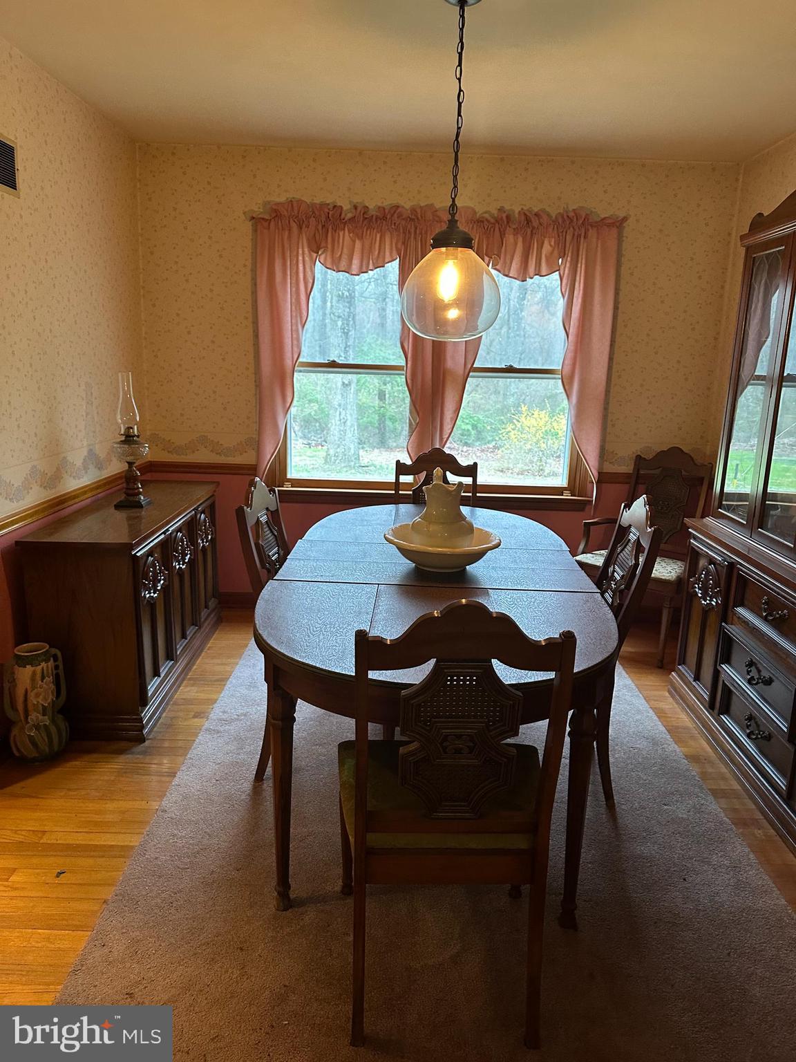575 Centerton Road Elmer, NJ 08318 - Photo 17 of 28 a view of a dining room with furniture window and wooden floor