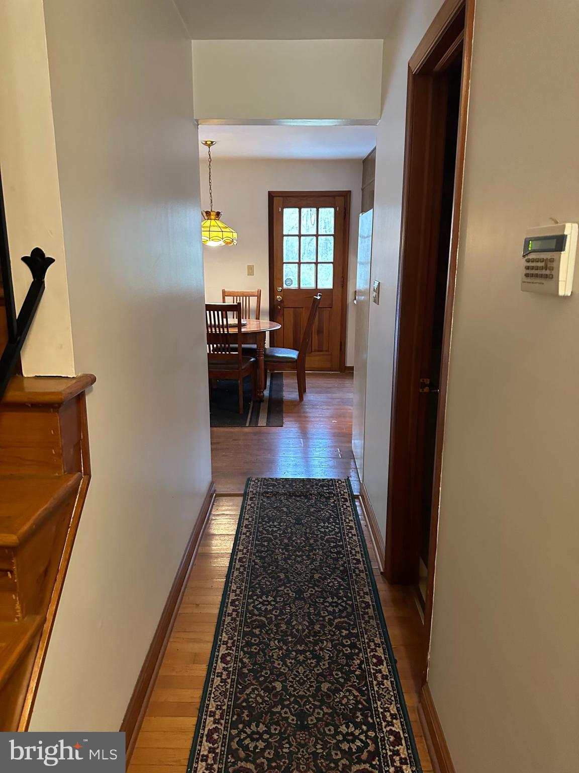 575 Centerton Road Elmer, NJ 08318 - Photo 19 of 28 a hallway with wooden floor and a rug