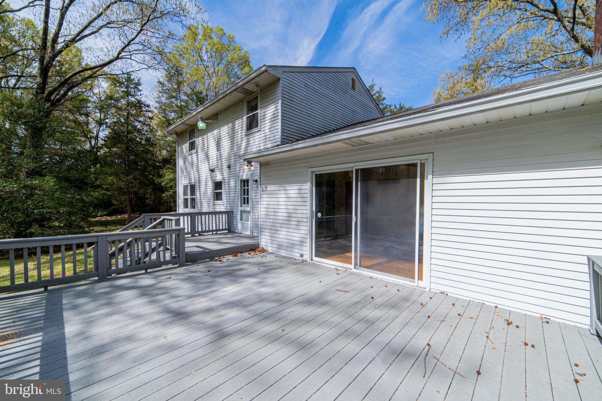 575 Centerton Road Elmer, NJ 08318 - Photo 2 of 28 a view of house with deck and outdoor seating