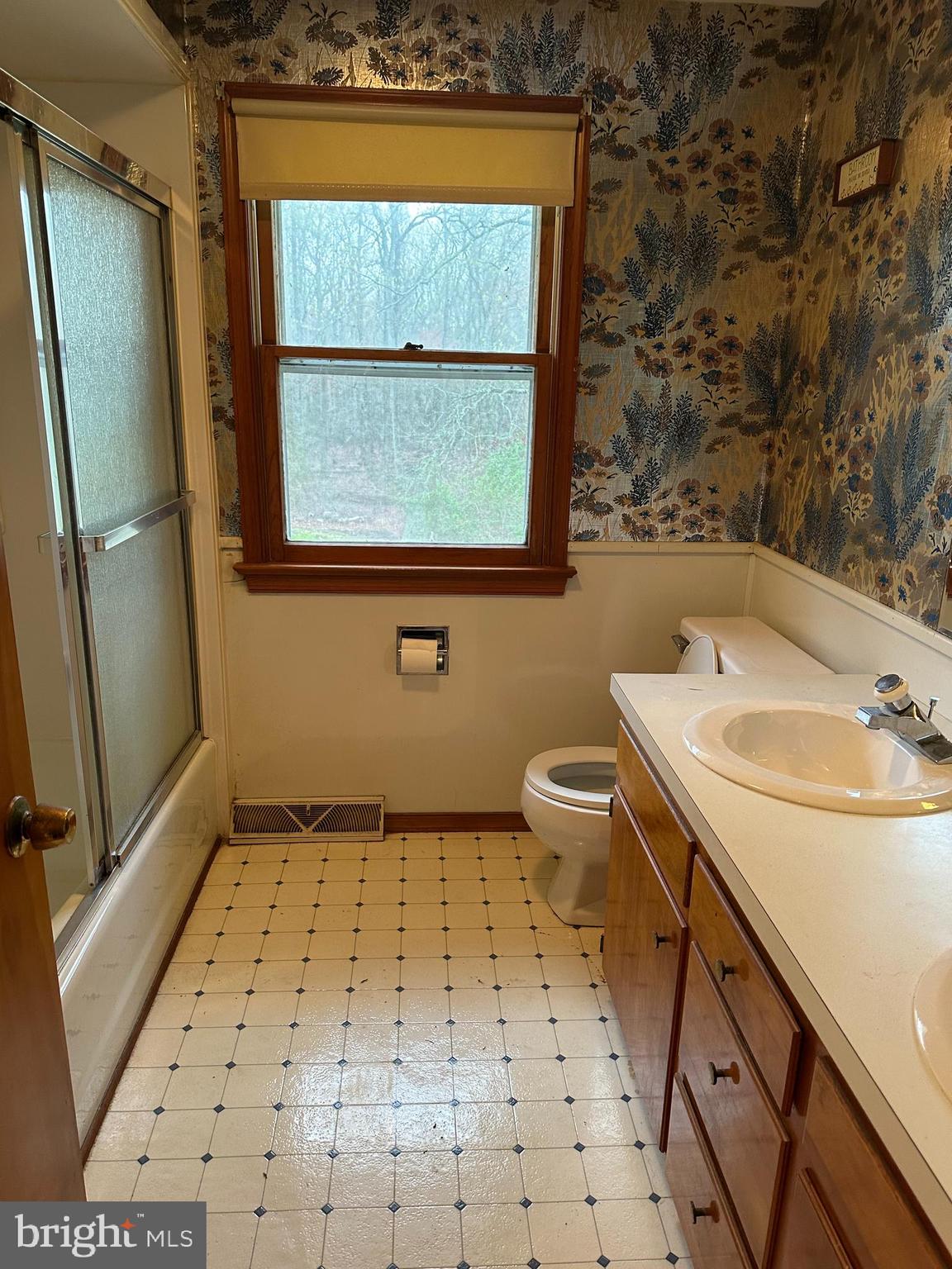 575 Centerton Road Elmer, NJ 08318 - Photo 27 of 28 a bathroom with a sink a toilet and shower curtain