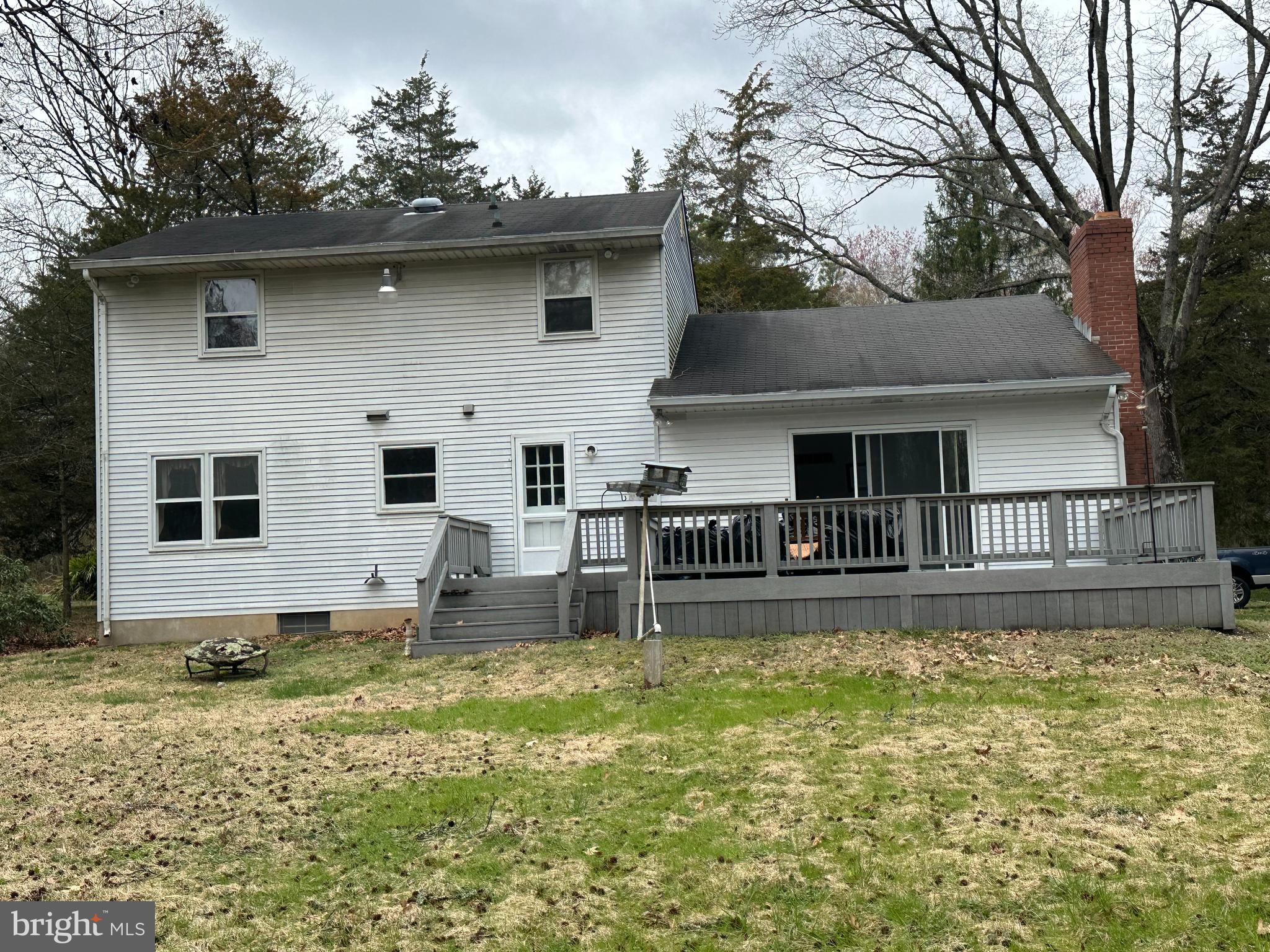 575 Centerton Road Elmer, NJ 08318 - Photo 3 of 28 a backyard of a house with table and chairs