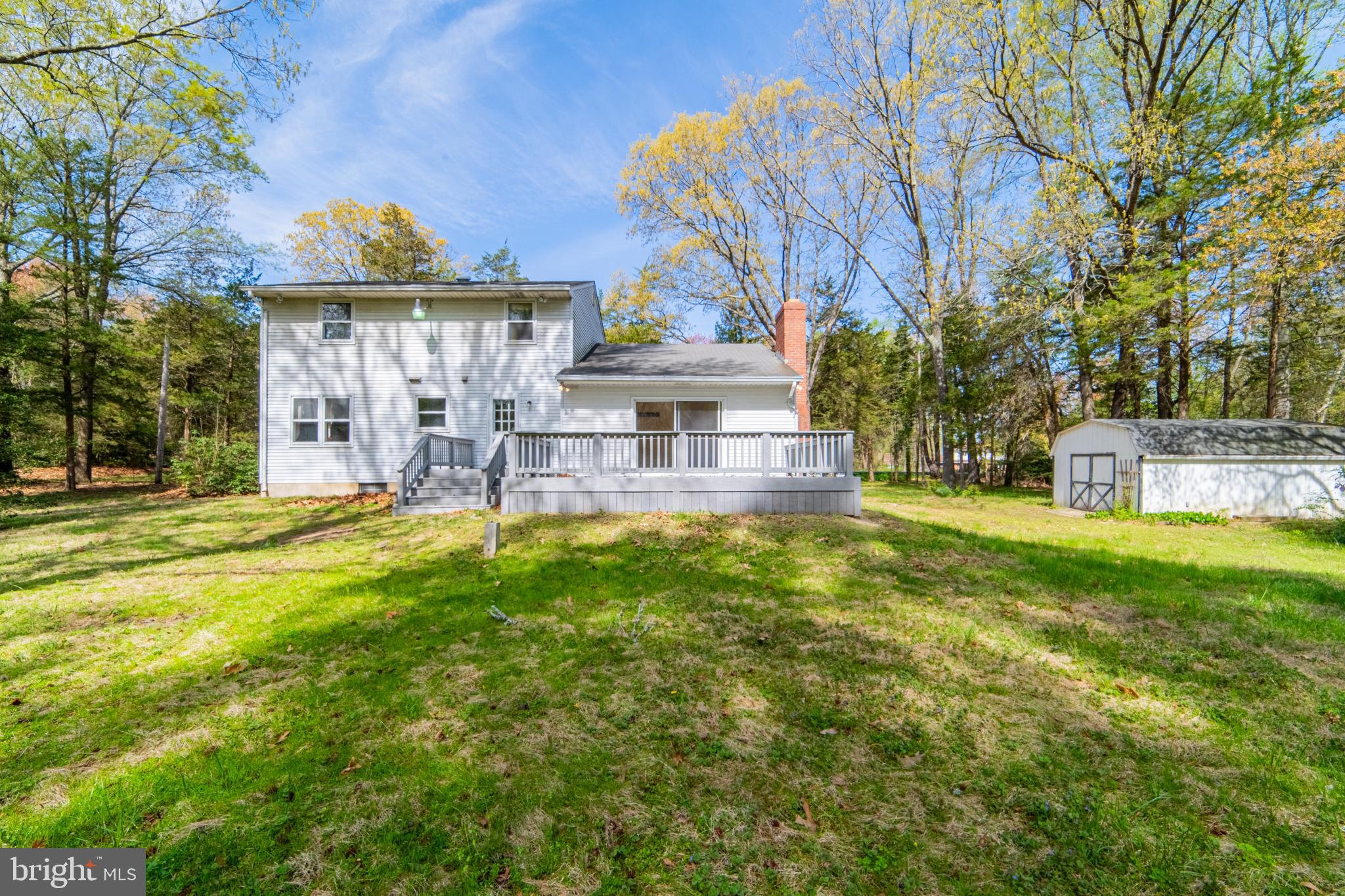 575 Centerton Road Elmer, NJ 08318 - Photo 6 of 28 a view of a house with a big yard potted plants and large tree