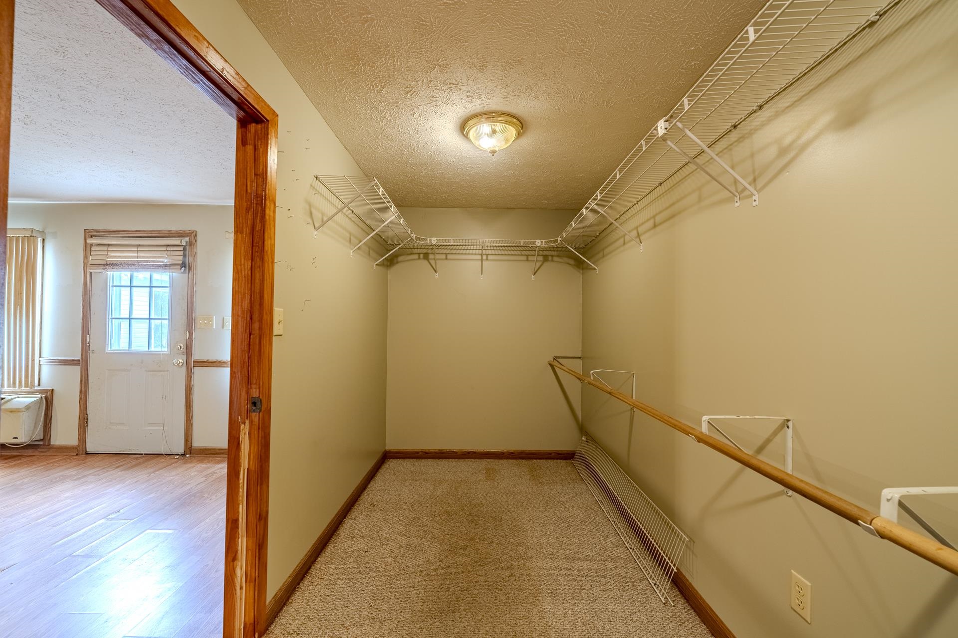 859 Old Morris Chapel Road Adamsville, TN 38310 - Photo 30 of 39 Carpeted closet with wire shelving system and overhead lighting