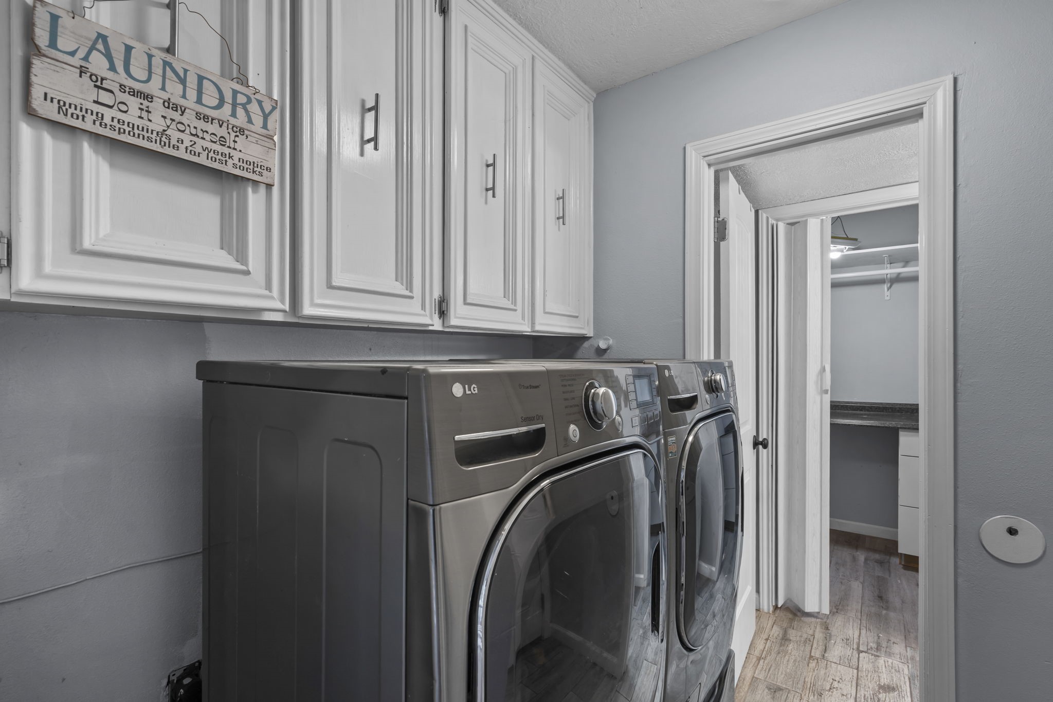 7009 Avenue R Santa Fe, TX 77510 - Photo 17 of 48 Utility room in the house with attached 1/2 bath and storage.