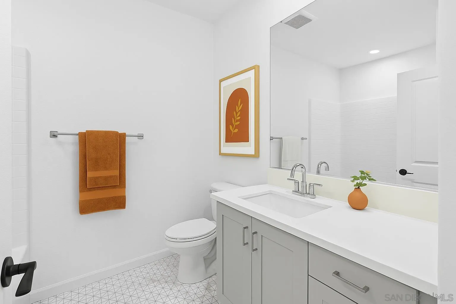 2104 Bluestone Circle Chula Vista, CA 91913 - Photo 11 of 21 a bathroom with a sink a toilet and mirror