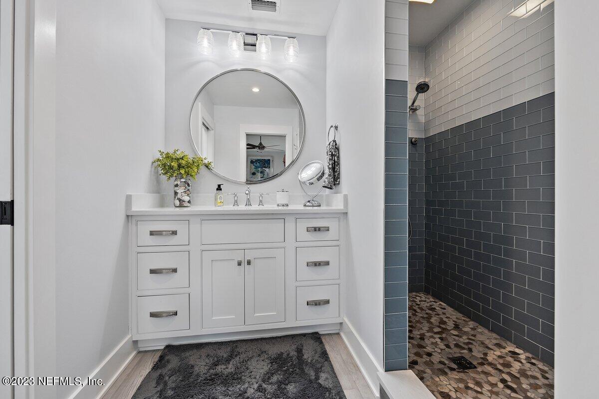 1320 4th Street Neptune Beach, FL 32266 - Photo 12 of 30 a bathroom with a sink and a mirror