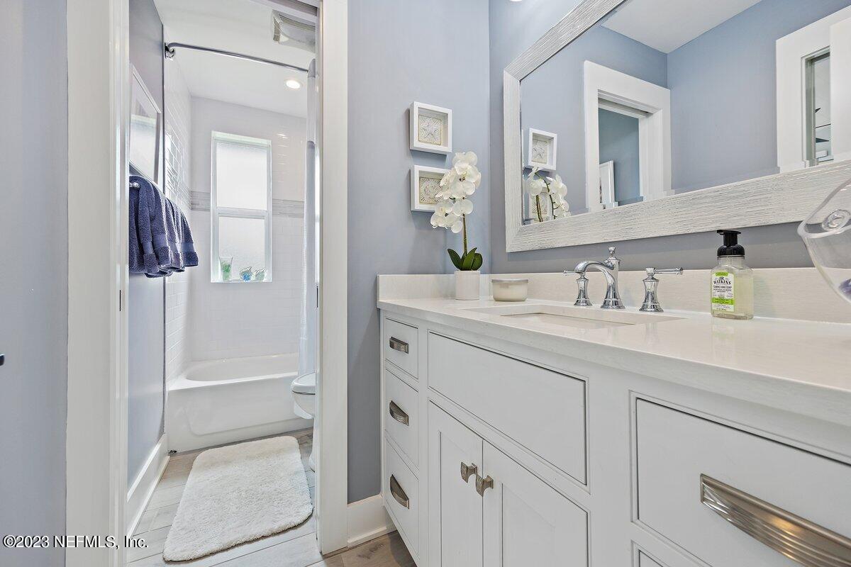 1320 4th Street Neptune Beach, FL 32266 - Photo 15 of 30 a bathroom with a sink and a mirror