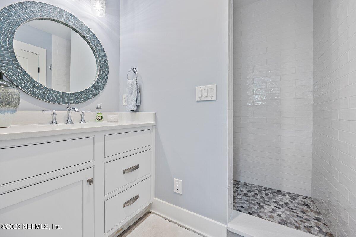 1320 4th Street Neptune Beach, FL 32266 - Photo 17 of 30 a bathroom with a sink a vanity and a mirror