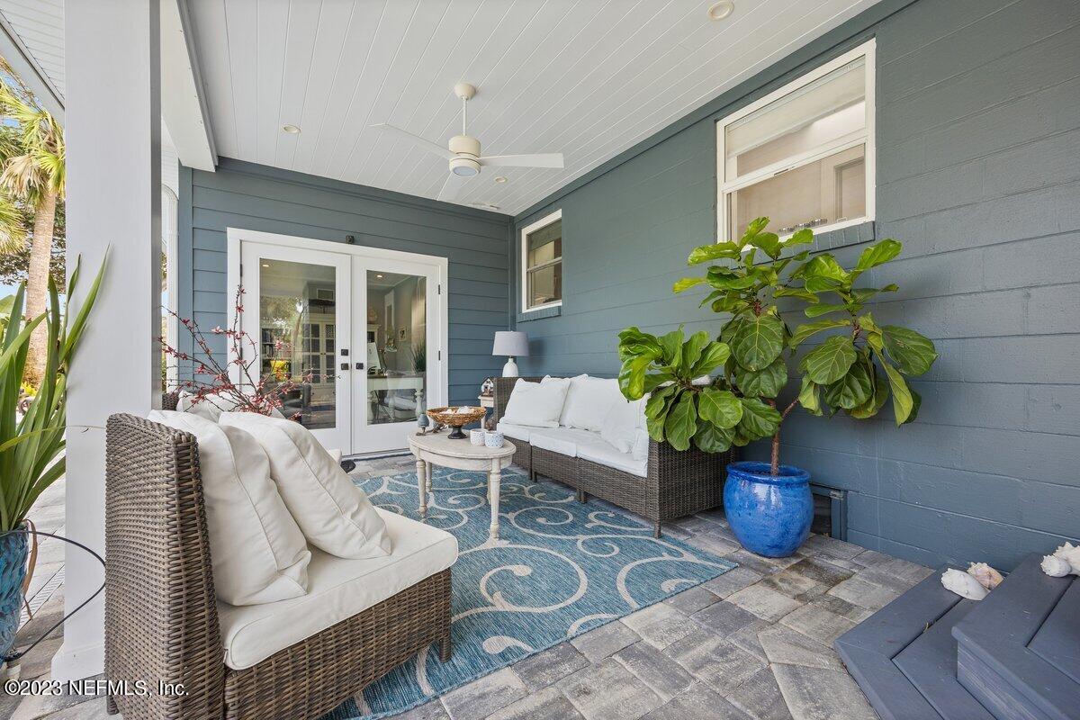 1320 4th Street Neptune Beach, FL 32266 - Photo 22 of 30 a living room with furniture potted plant and a window