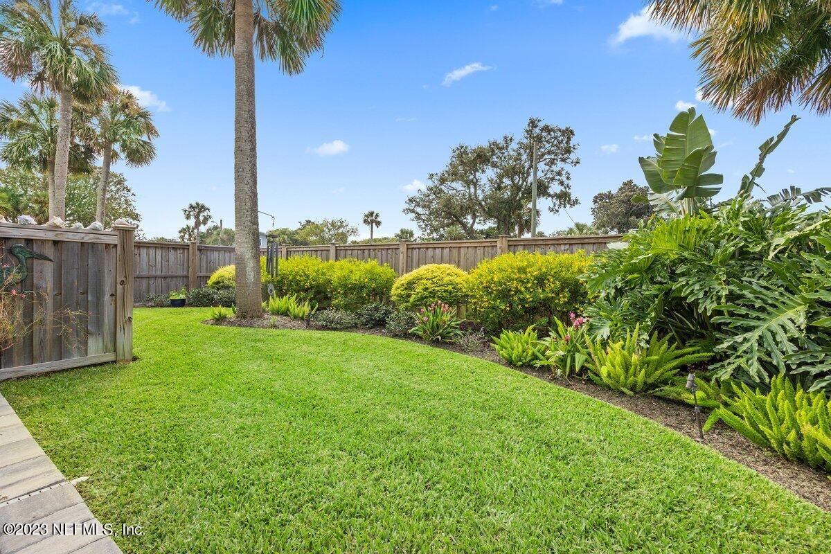 1320 4th Street Neptune Beach, FL 32266 - Photo 23 of 30 a garden with palm trees