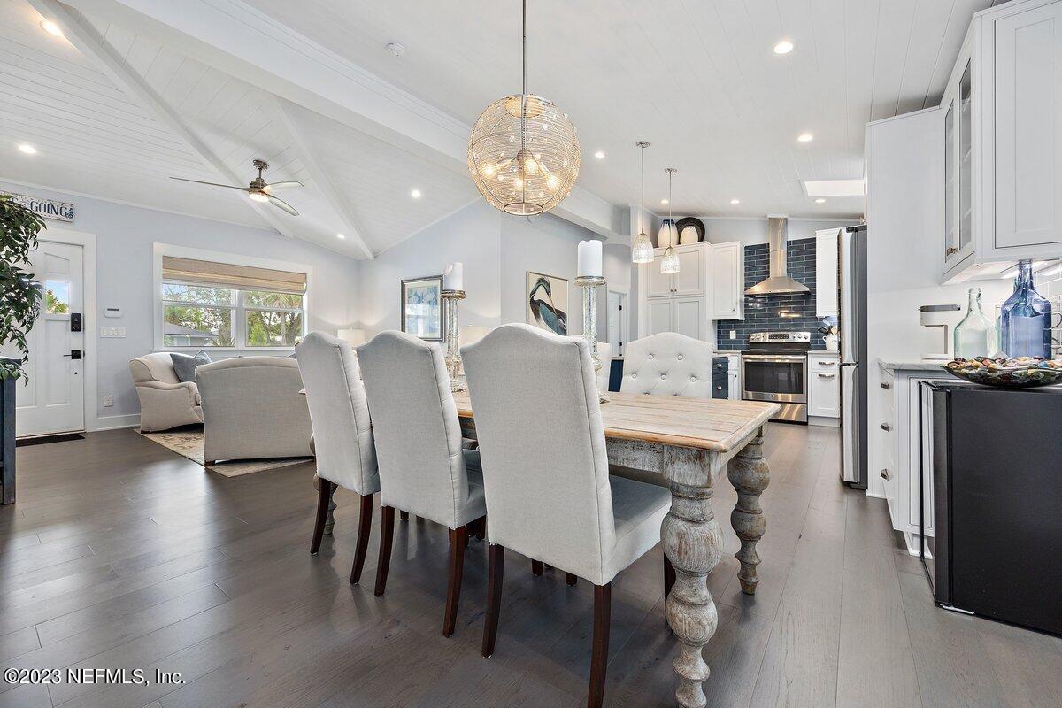 1320 4th Street Neptune Beach, FL 32266 - Photo 6 of 30 a view of a dining room with furniture and wooden floor