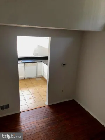 a view of a workspace with furniture and a potted plant