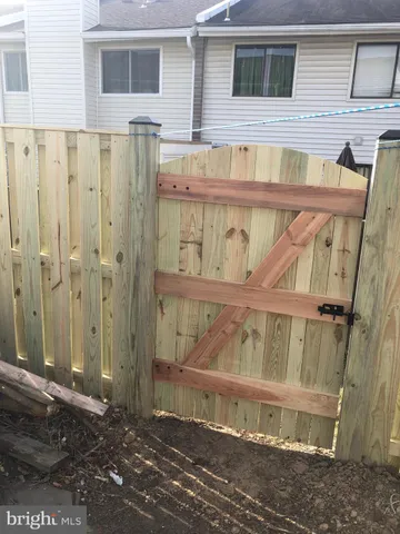 a kitchen with stainless steel appliances a stove a microwave and white cabinets