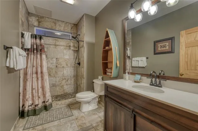 a bedroom with furniture and a fireplace