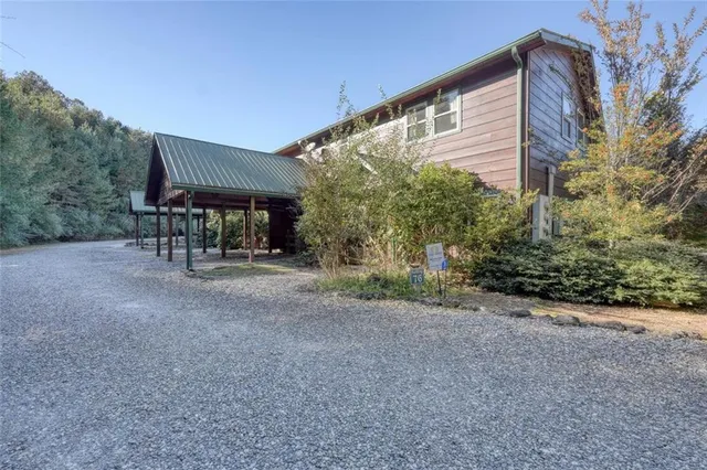 a view of a house with backyard and porch