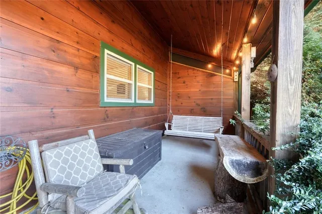 a view of a chairs and table in backyard