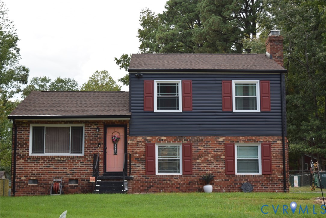 3102 Oxnard Road Richmond, VA 23223 - Photo 1 of 5 Brick and siding exterior with red window shutters