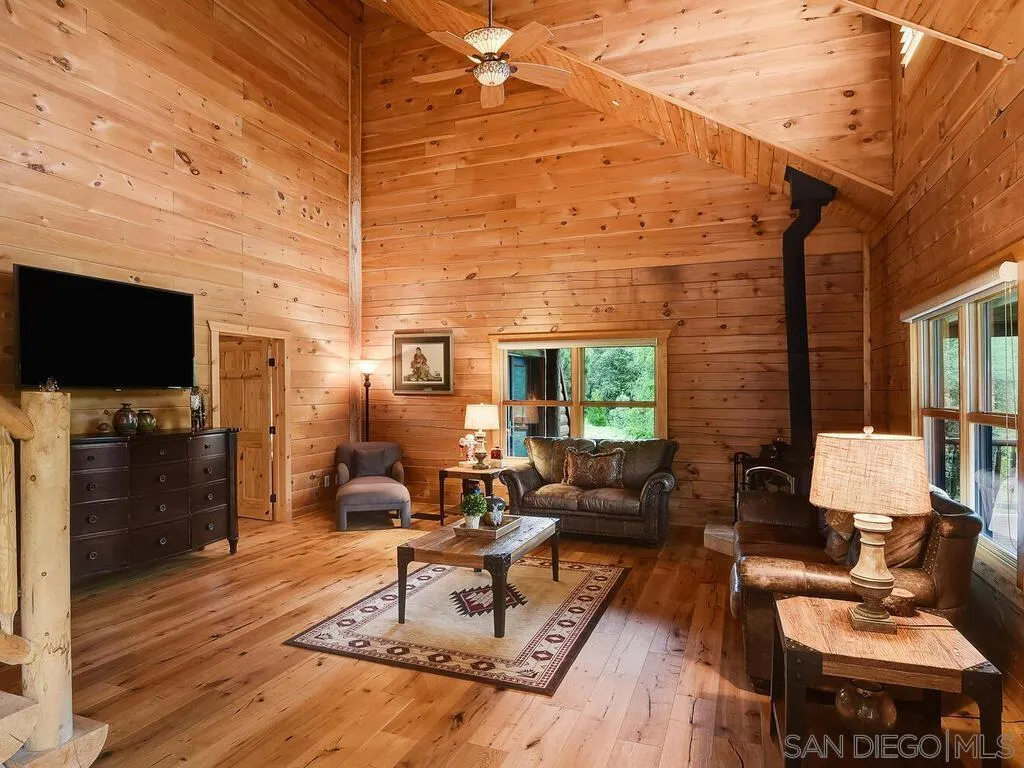 1068 West Incense Cedar Road Julian, CA 92036 - Photo 11 of 63 a living room with furniture and a flat screen tv