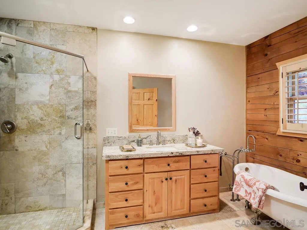 1068 West Incense Cedar Road Julian, CA 92036 - Photo 21 of 63 a bathroom with a sink double vanity and a mirror