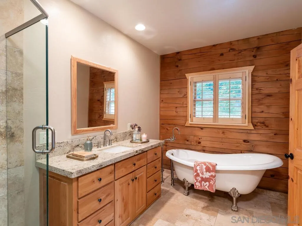 1068 West Incense Cedar Road Julian, CA 92036 - Photo 22 of 63 a spacious bathroom with a tub sink and mirror