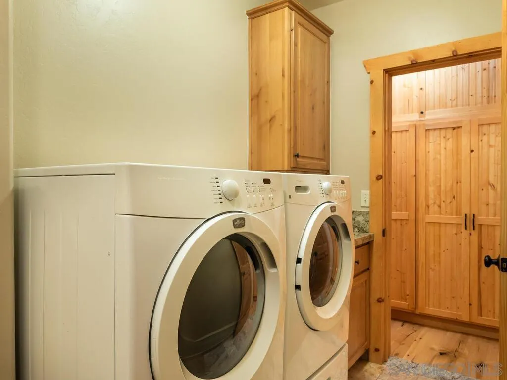 1068 West Incense Cedar Road Julian, CA 92036 - Photo 26 of 63 a utility room with dryer and washer