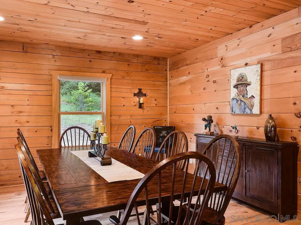 1068 West Incense Cedar Road Julian, CA 92036 - Photo 30 of 63 a view of a dining room with furniture window and outside view