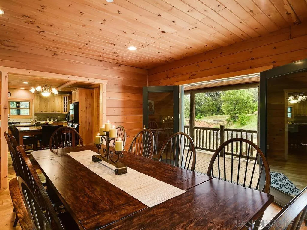 1068 West Incense Cedar Road Julian, CA 92036 - Photo 32 of 63 a view of a dining room with furniture window and wooden floor