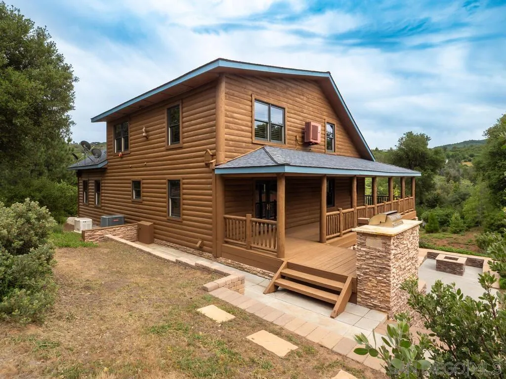 1068 West Incense Cedar Road Julian, CA 92036 - Photo 50 of 63 a front view of a house with a yard