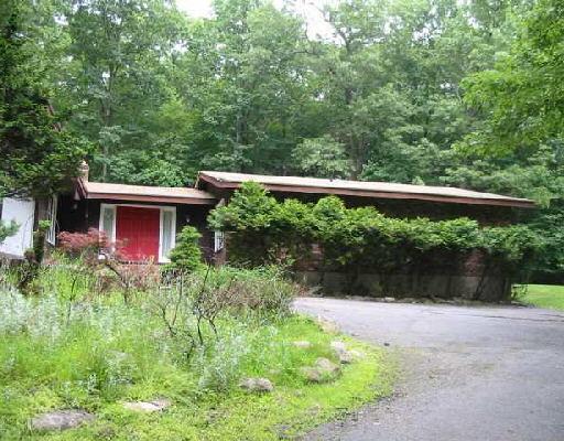 25 Bruschi Lane Ridgefield, CT 06877 - Photo 1 of 1 a view of a wooden house with a yard
