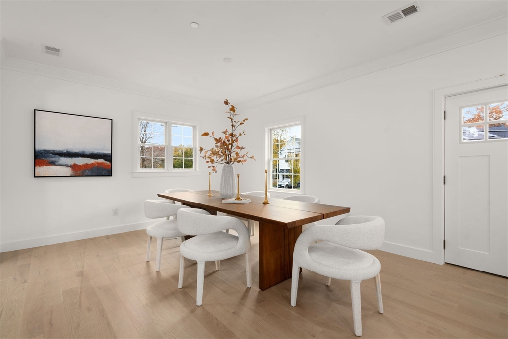 63 Oak Street, Unit B Wellesley, MA 02482 - Photo 11 of 26 a dining room with a table and chairs