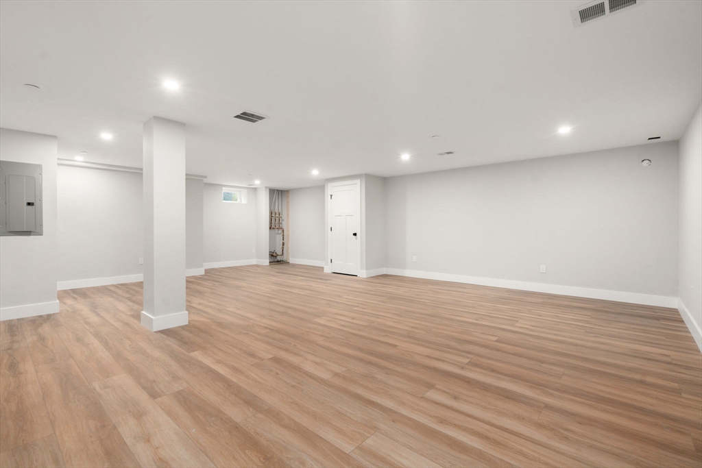 63 Oak Street, Unit B Wellesley, MA 02482 - Photo 23 of 26 a view of an empty room with wooden floor