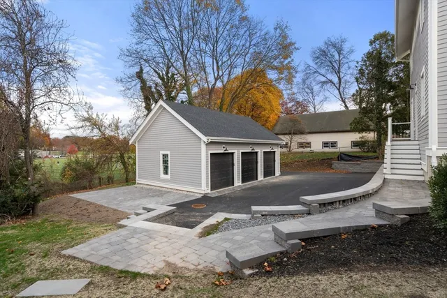 a backyard of a house with outdoor seating