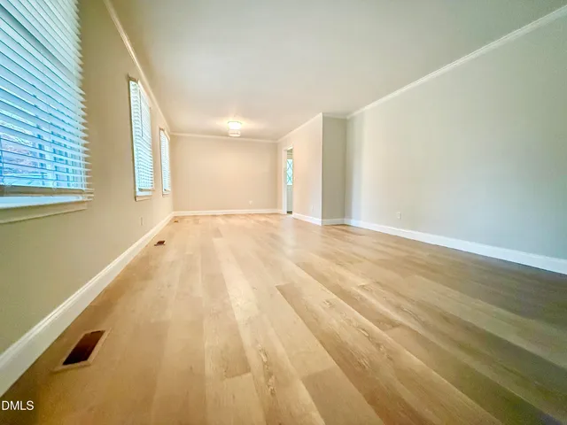 a view of an empty room and window