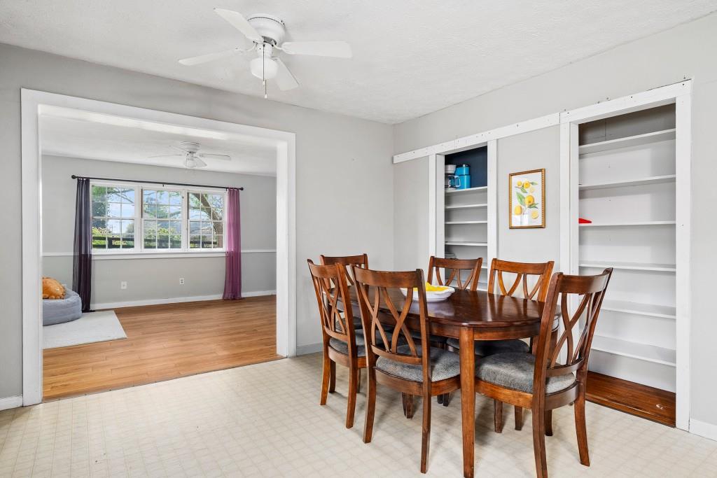 16685 Hopewell Road Milton, GA 30004 - Photo 17 of 64 a view of a dining room with furniture window and wooden floor