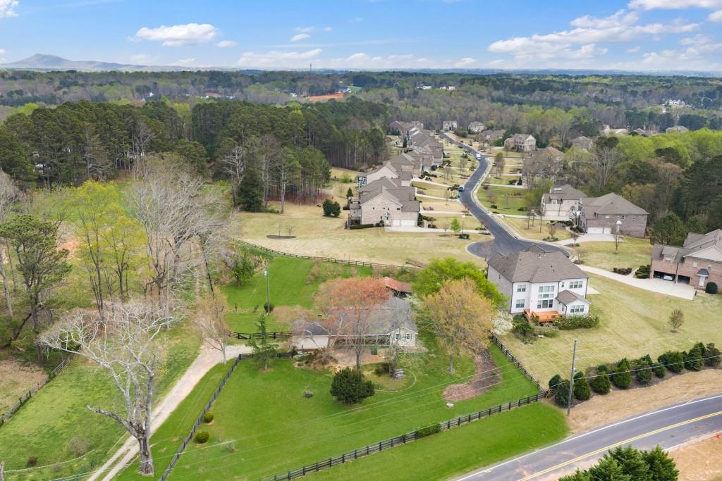 16685 Hopewell Road Milton, GA 30004 - Photo 38 of 64 an aerial view of residential houses with outdoor space and lake view