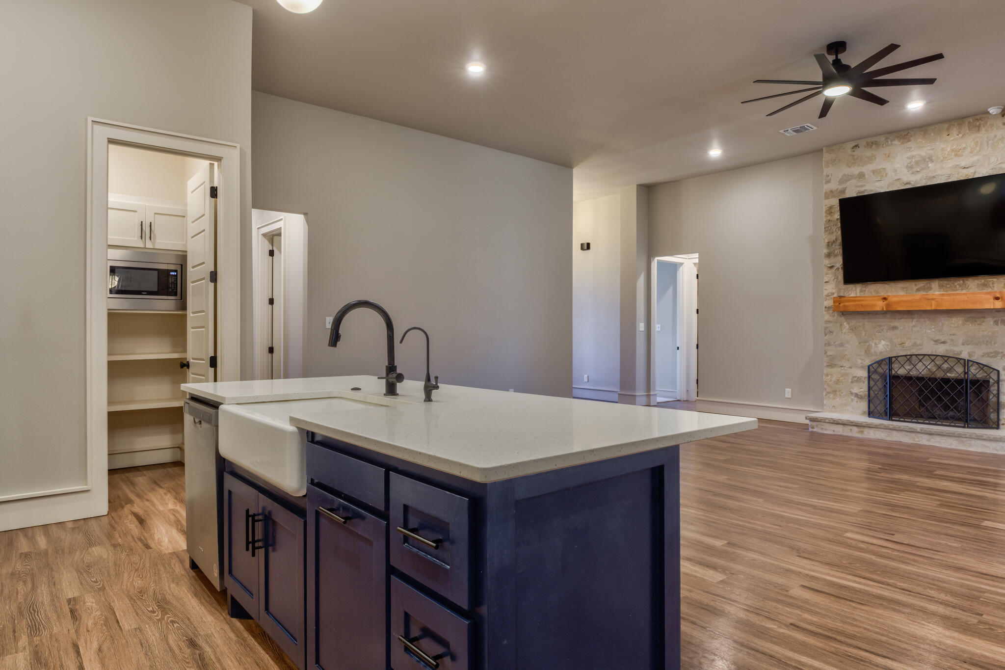 5303 110th Street Lubbock, TX 79424 - Photo 22 of 55 a kitchen with a sink and a stove top oven