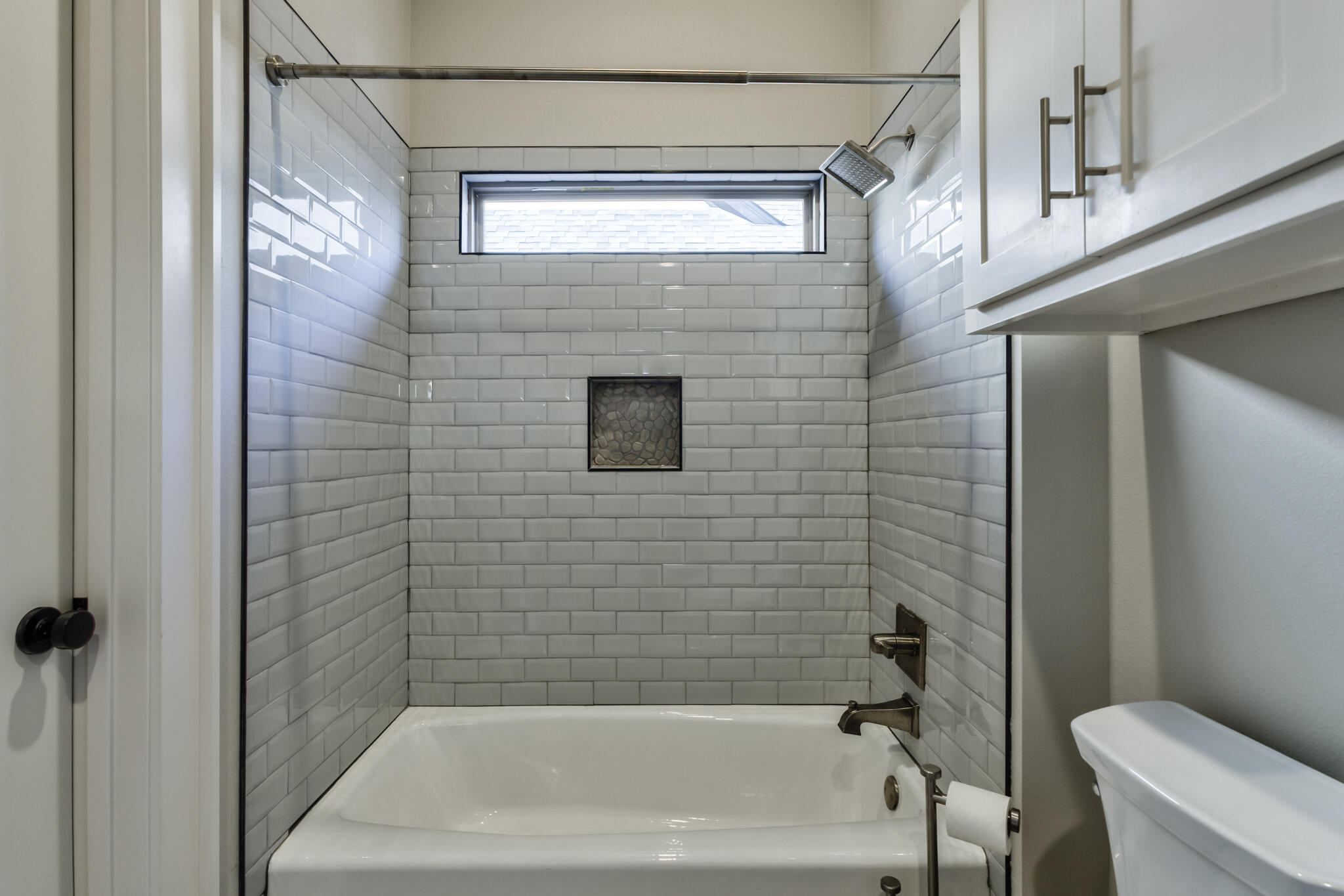5303 110th Street Lubbock, TX 79424 - Photo 28 of 55 a bathroom with a bathtub and a shower