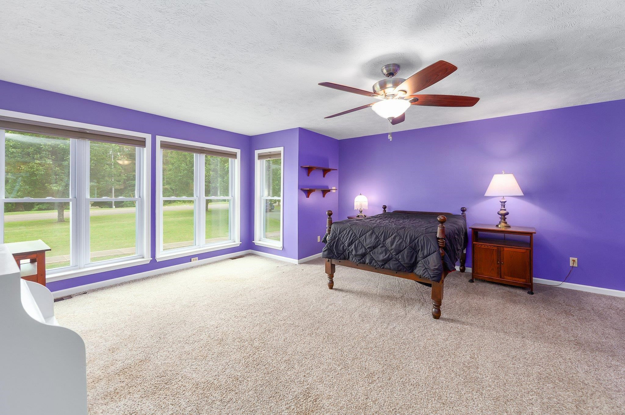 65 Jennalee Lane Medon, TN 38356 - Photo 17 of 43 a spacious bedroom with a bed and a ceiling fan