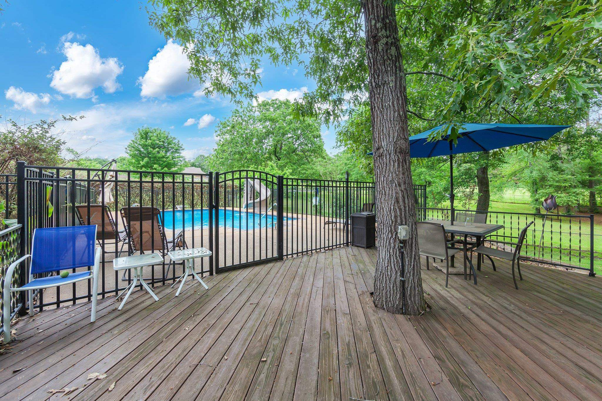 65 Jennalee Lane Medon, TN 38356 - Photo 31 of 43 a view of a chairs and table in the wooden deck