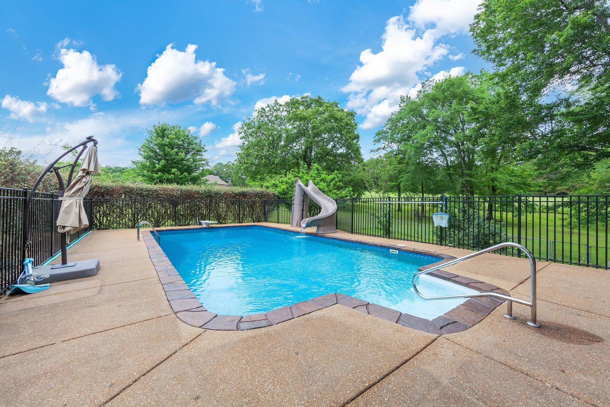 65 Jennalee Lane Medon, TN 38356 - Photo 33 of 43 a view of a swimming pool with a patio and a yard