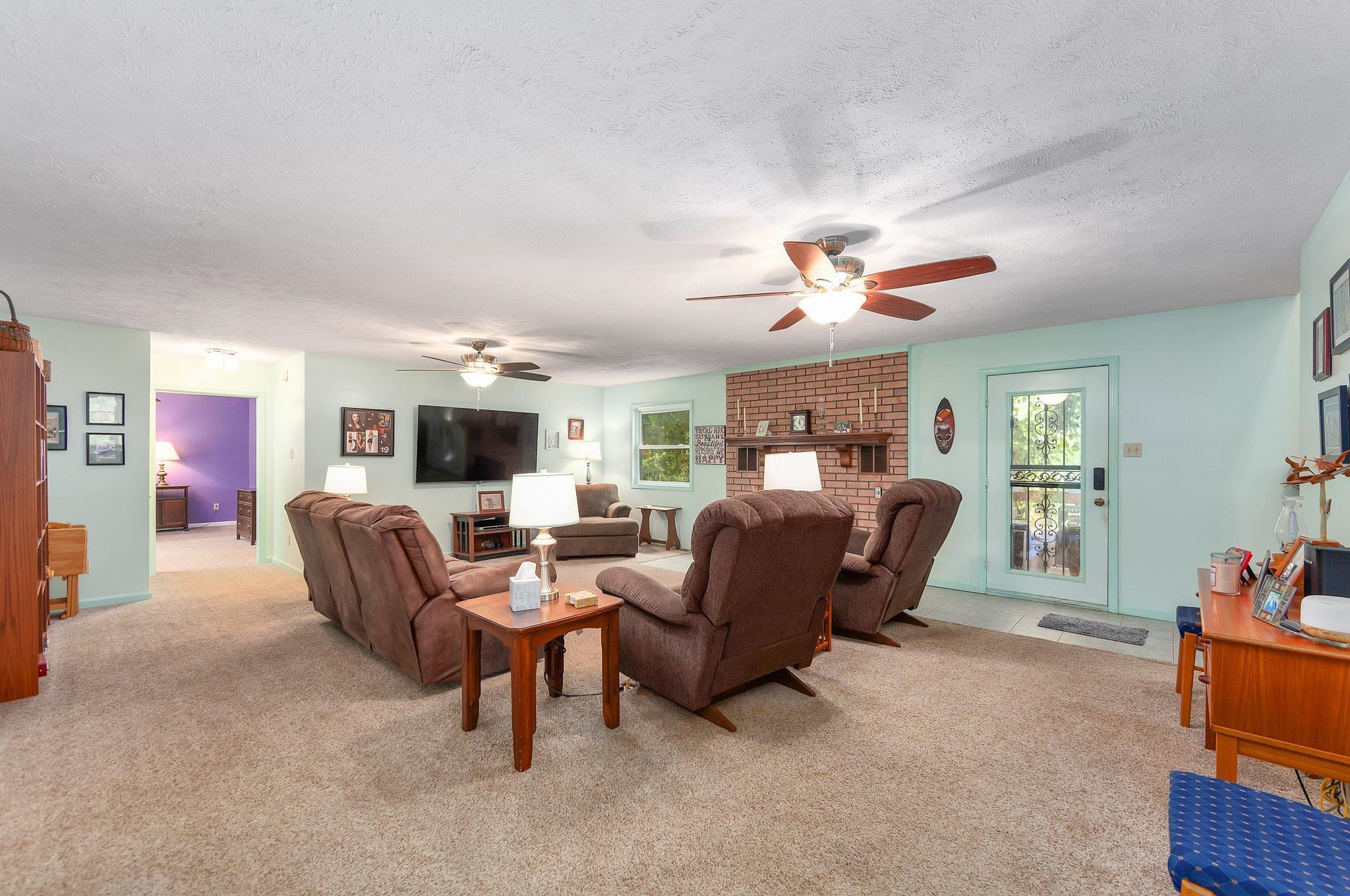 65 Jennalee Lane Medon, TN 38356 - Photo 8 of 43 a living room with furniture ceiling fan and a window
