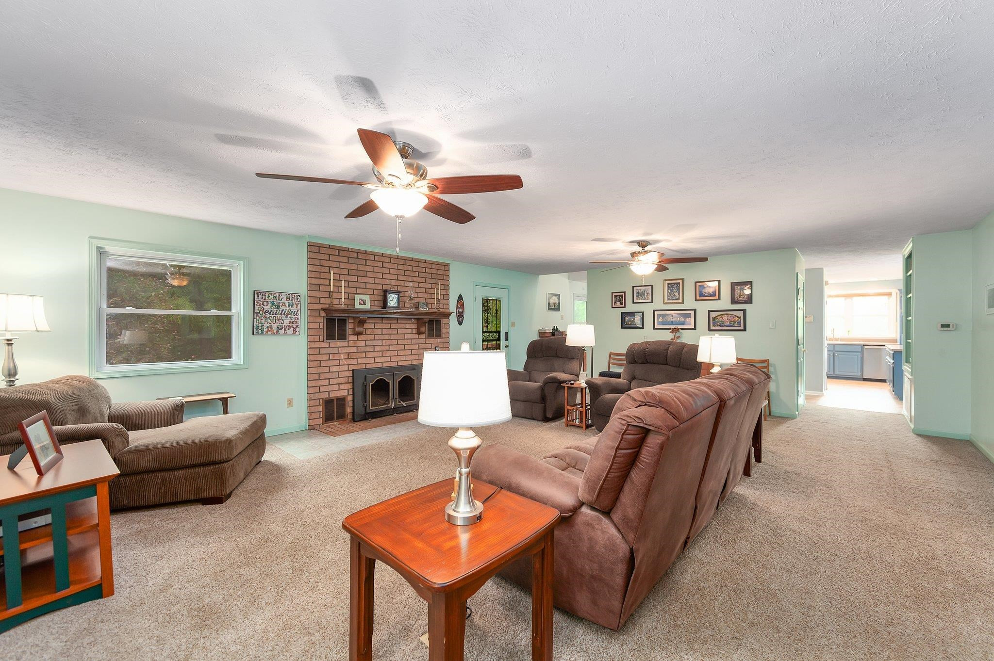 65 Jennalee Lane Medon, TN 38356 - Photo 10 of 43 a living room with furniture a fireplace and a window